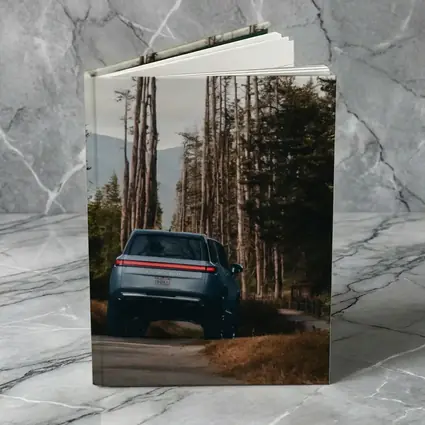 Rivian R1S SUV Winding Forest Mountain Road