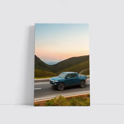 Rivian R1T Truck Rolling Through Mountain Valley