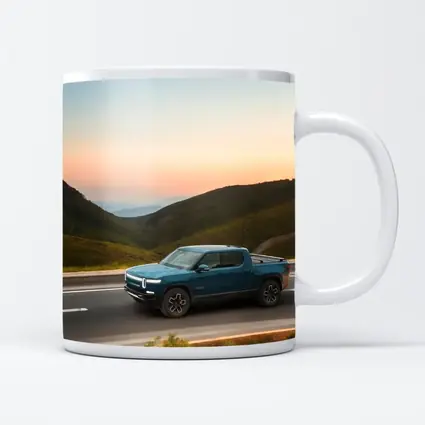 Rivian R1T Truck Rolling Through Mountain Valley