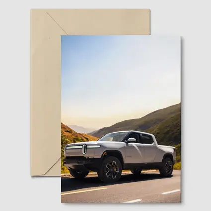 Rivian R1T Electric Truck Mountain Highway Sunrise