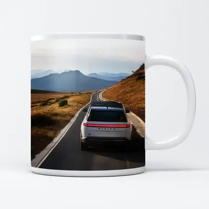 Rivian R1S On Mountain Road At Dusk