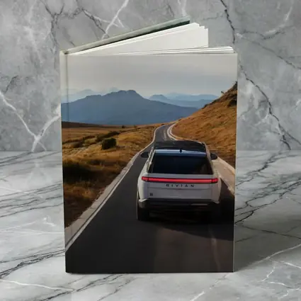 Rivian R1S On Mountain Road At Dusk