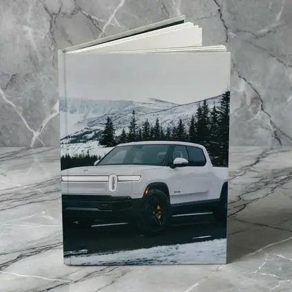 Rivian R1T White Truck Snowy Mountain Road