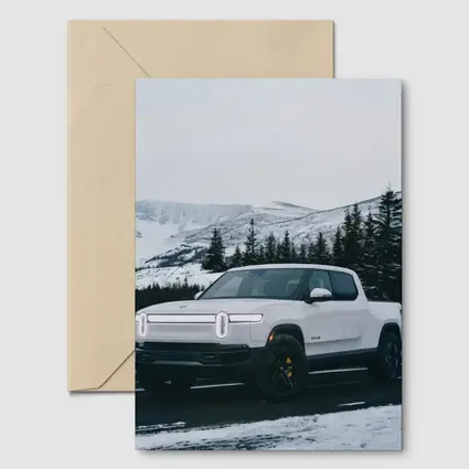 Rivian R1T White Truck Snowy Mountain Road