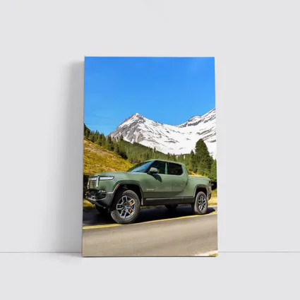 Rivian R1T Green Truck Snowy Mountain Road