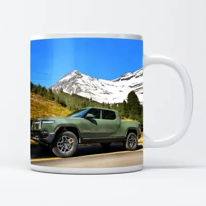 Rivian R1T Green Truck Snowy Mountain Road