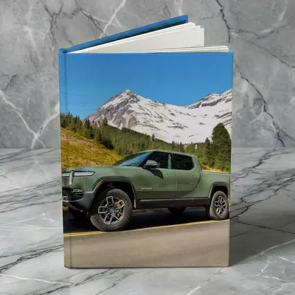 Rivian R1T Green Truck Snowy Mountain Road