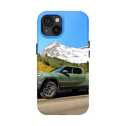 Rivian R1T Green Truck Snowy Mountain Road