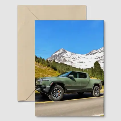 Rivian R1T Green Truck Snowy Mountain Road