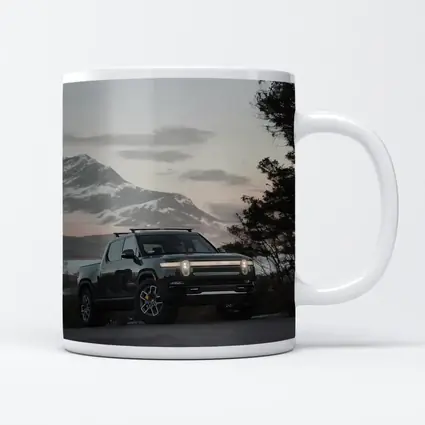 Rivian R1T Black Truck Winter Mountain Dusk
