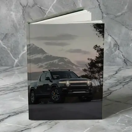 Rivian R1T Black Truck Winter Mountain Dusk