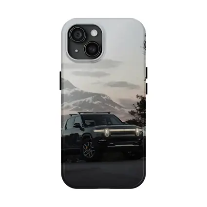 Rivian R1T Black Truck Winter Mountain Dusk