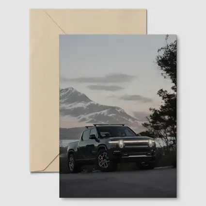 Rivian R1T Black Truck Winter Mountain Dusk