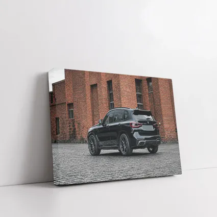 Black BMW X5M Parked Near Brick Building
