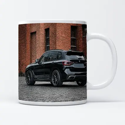 Black BMW X5M Parked Near Brick Building