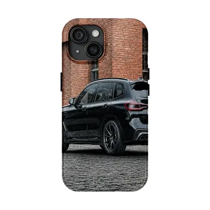 Black BMW X5M Parked Near Brick Building