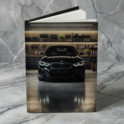 Black BMW Sedan Parked in Dark Garage