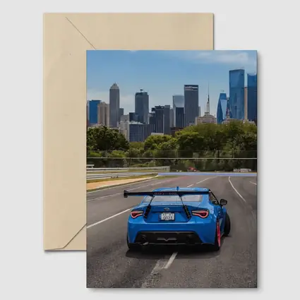 Blue Subaru BRZ on City Track
