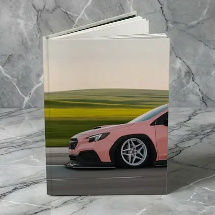 Pink Subaru WRX Speeding Through Green Fields