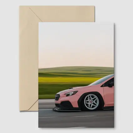 Pink Subaru WRX Speeding Through Green Fields