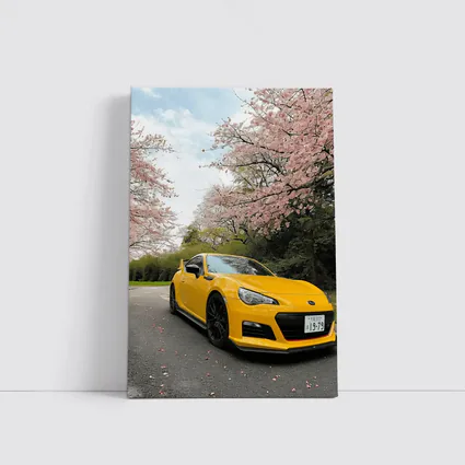 Yellow Subaru BRZ Under Cherry Blossoms