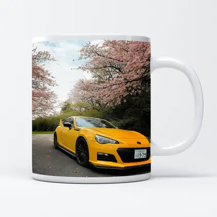 Yellow Subaru BRZ Under Cherry Blossoms