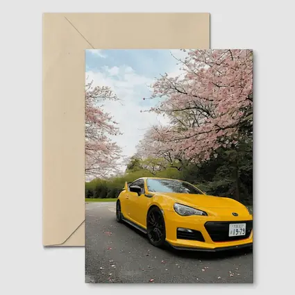 Yellow Subaru BRZ Under Cherry Blossoms