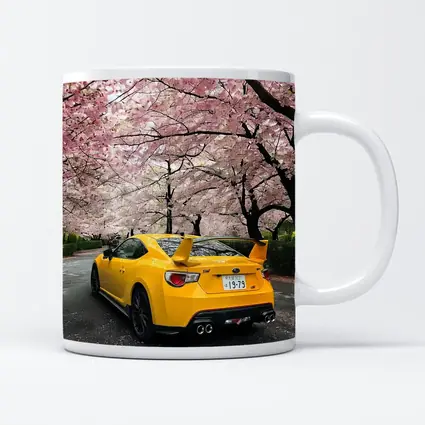 Yellow Subaru BRZ Under Cherry Blossoms