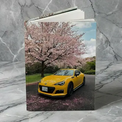 Subaru BRZ Yellow Under Cherry Blossoms