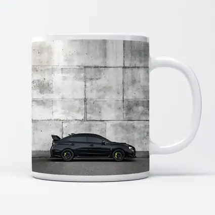 Subaru WRX STI Black Against Concrete Wall