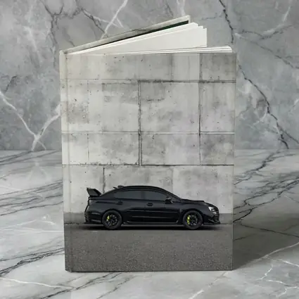Subaru WRX STI Black Against Concrete Wall