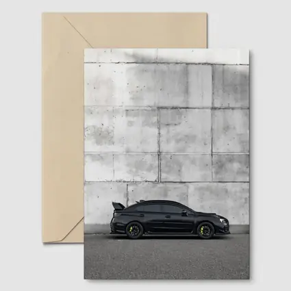 Subaru WRX STI Black Against Concrete Wall