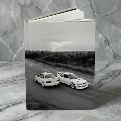 Two White Subaru Impreza WRX On Road