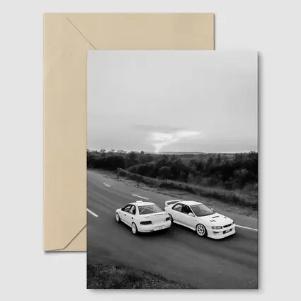 Two White Subaru Impreza WRX On Road