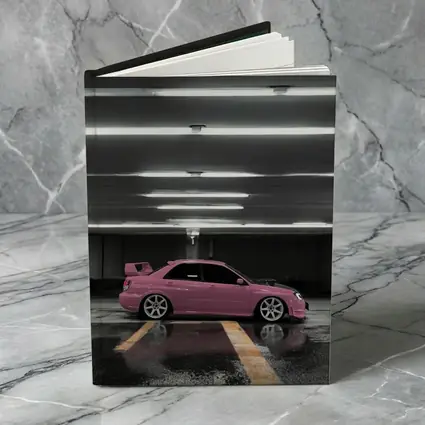 Pink Subaru WRX Parked Underground Garage