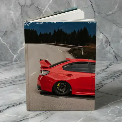 Red Subaru WRX STI Snowy Mountain Road