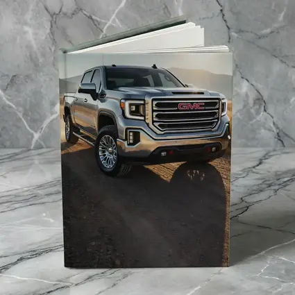 GMC Sierra Truck on Dusty Dirt Road