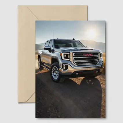 GMC Sierra Truck on Dusty Dirt Road