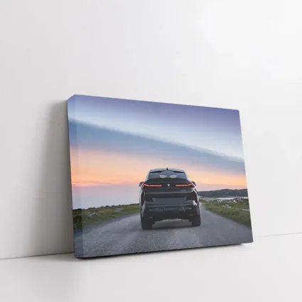 BMW X6M Rear View Sunset Road