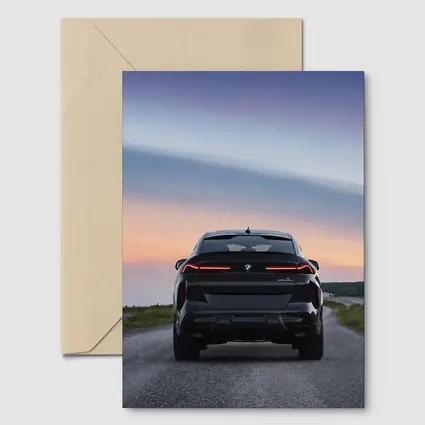 BMW X6M Rear View Sunset Road