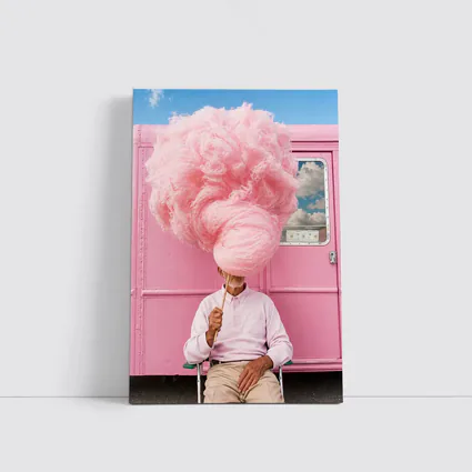 Man Holding Giant Pink Cotton Candy Outdoors
