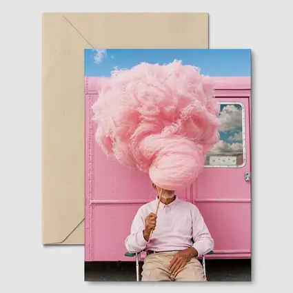 Man Holding Giant Pink Cotton Candy Outdoors