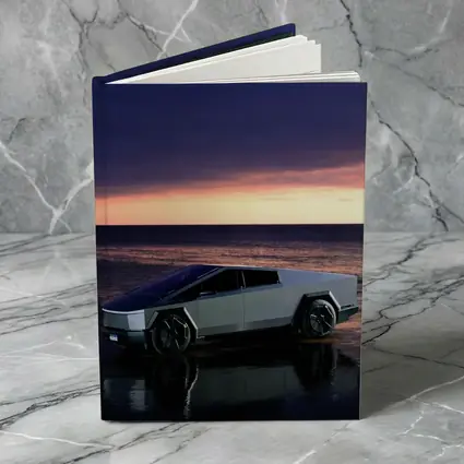Tesla Cybertruck Parked on Beach at Sunset