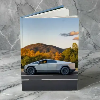 Tesla Cybertruck Driving Through Autumn Mountain Road