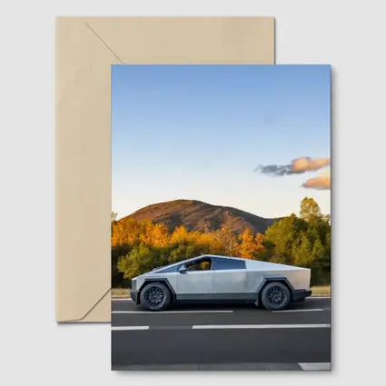Tesla Cybertruck Driving Through Autumn Mountain Road