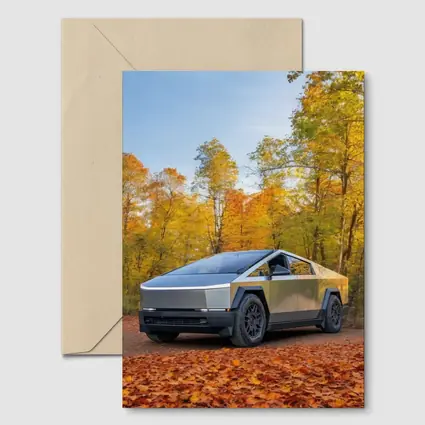 Tesla Cybertruck Parked Among Autumn Trees