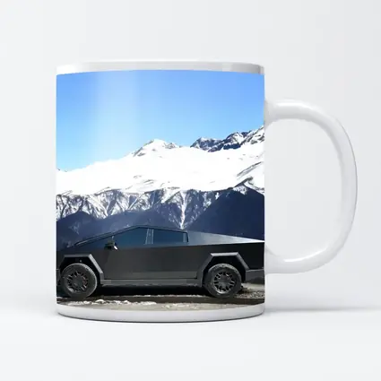 Tesla Cybertruck Parked Against Snowy Mountains