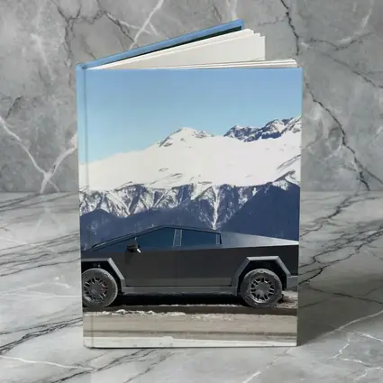 Tesla Cybertruck Parked Against Snowy Mountains