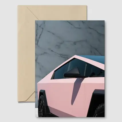 Pink Tesla Cybertruck Against Marble Wall