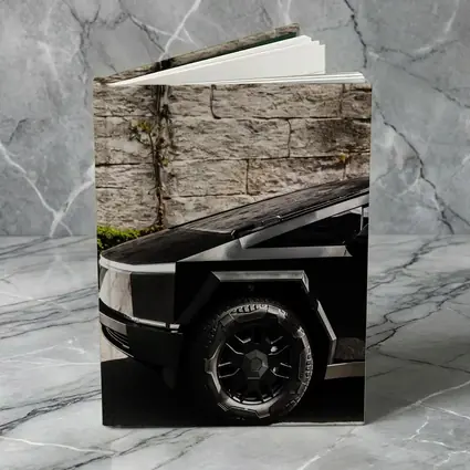 Tesla Cybertruck Black Against Stone Wall